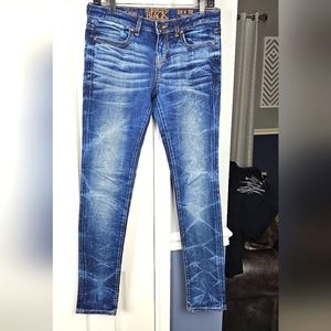 Buckle black skinny jeans